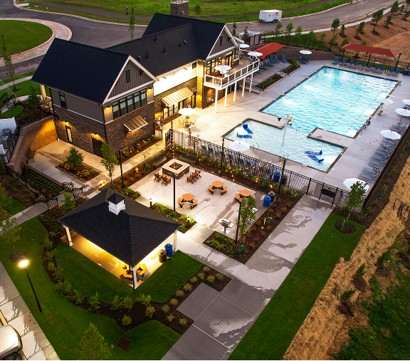 Aerial view of clubhouse and pool at Everstone at Cedar Hill in the evening
